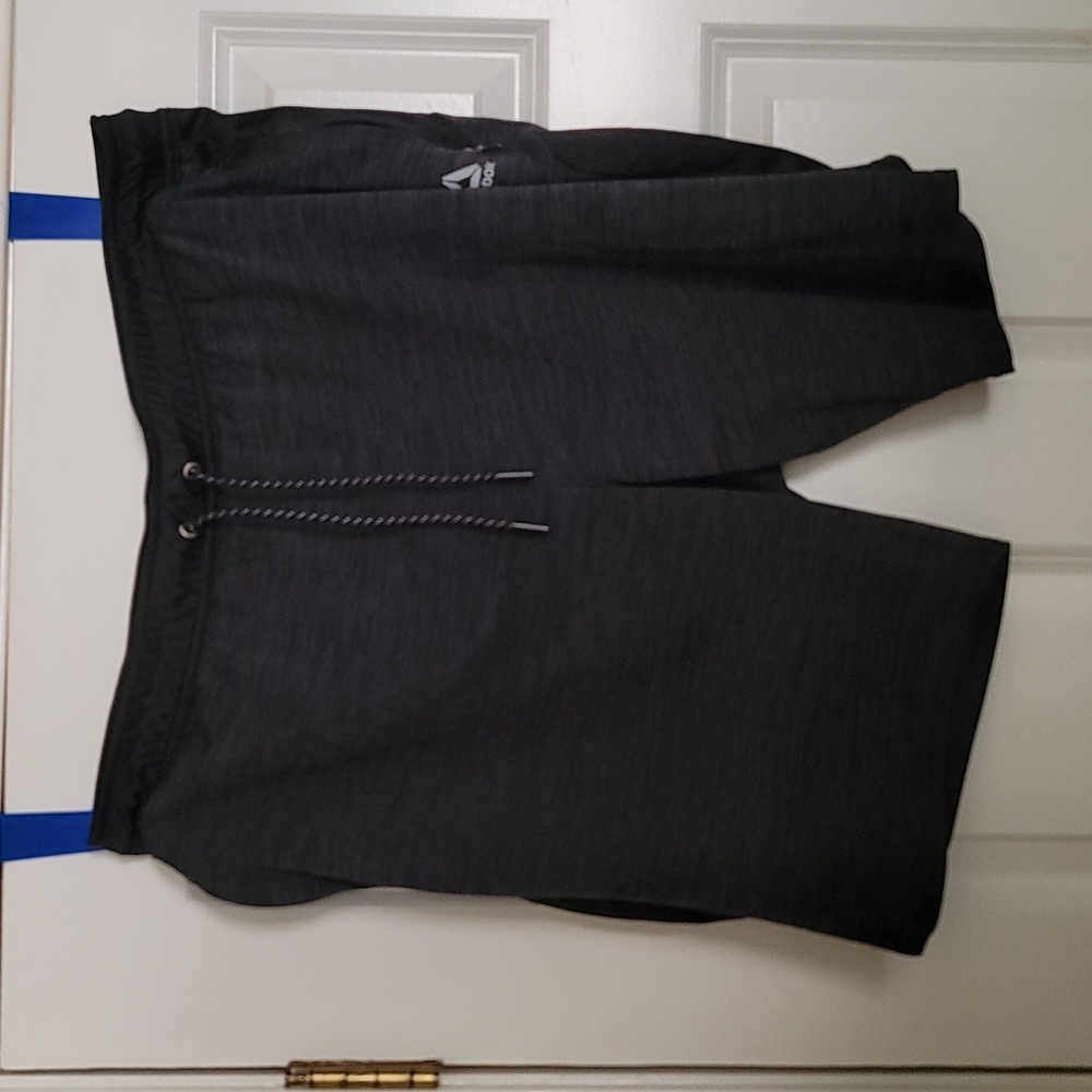 Reebok shorts with zipper pockets.